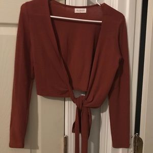 Rumor burnt orange wrap top
